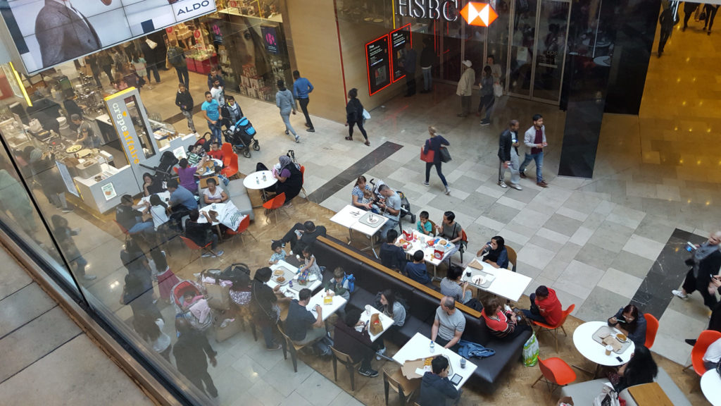 view overlooking a food court with people eating at tables