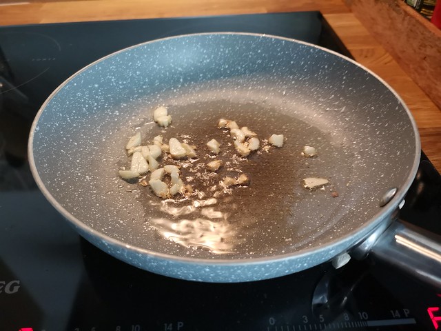 frying garlic in a frying pan