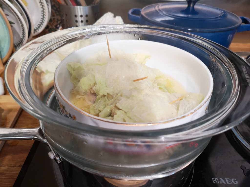 steamed cabbage with sticks in steamer